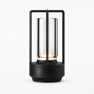 Morven Lantern cordless lamp in black, lit, front view on a plain background