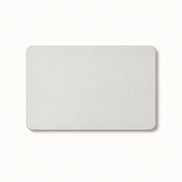 Morven Cairn diatomite stone bath mat in light grey, seen from above on a plain background