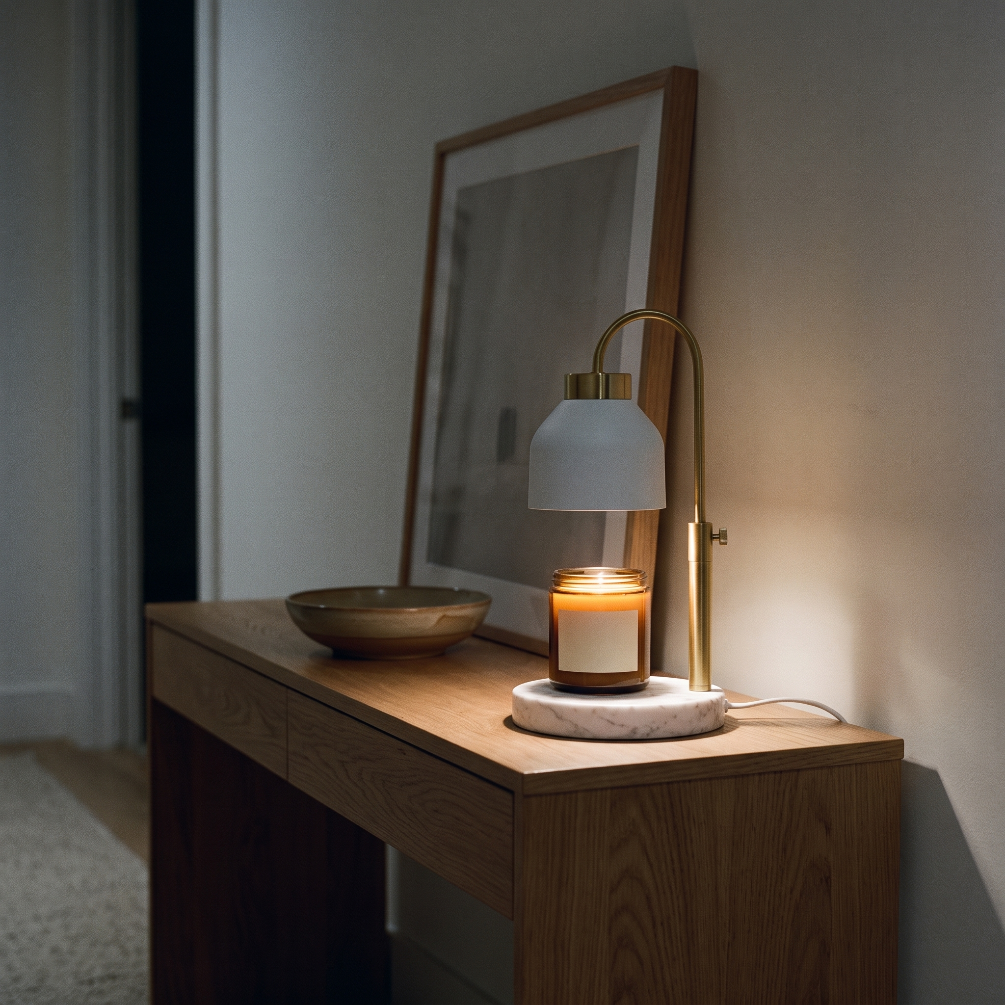 
              Morven Willow candle warmer lamp on a hallway console table, white dome shade on a marble base
            