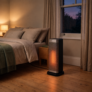 Morven Ingleside space heater beside a bed in a bedroom at dusk
