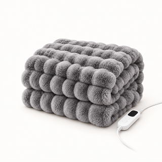 Morven Wrap heated throw in grey, folded with its controller, on a plain background
